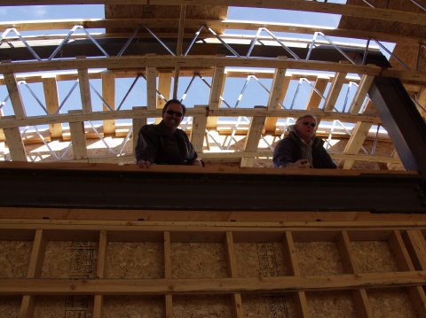 Marc Lemoine and Randy look down from above dining room