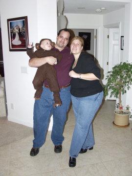 Mom and Dad Stowers with their monkey